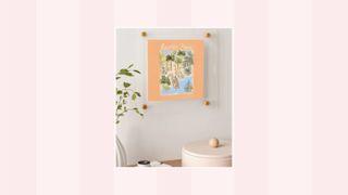 A picture of wall art on a pink and white background