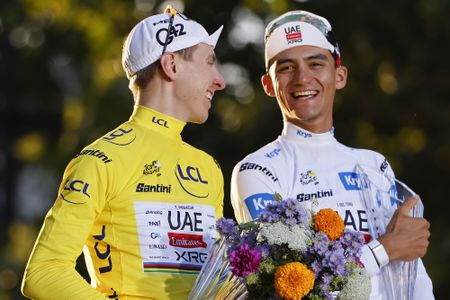 PARIS, FRANCE - JULY 26: Winner of the race leader's yellow jersey Tadej Pogacar of Slovenia and UAE Team Emirates - XRG, winner of the white jersey for 'best young' rider Isaac del Toro of Mexico and UAE Team Emirates - XRG during the podium ceremony following Stage 21 of the 113th Tour de France 2026, final stage of 88,7 km between Paris Champs Elysees and Paris Champs Elysees on July 26, 2026 in Paris, France. (Photo by Jean Catuffe/Getty Images)