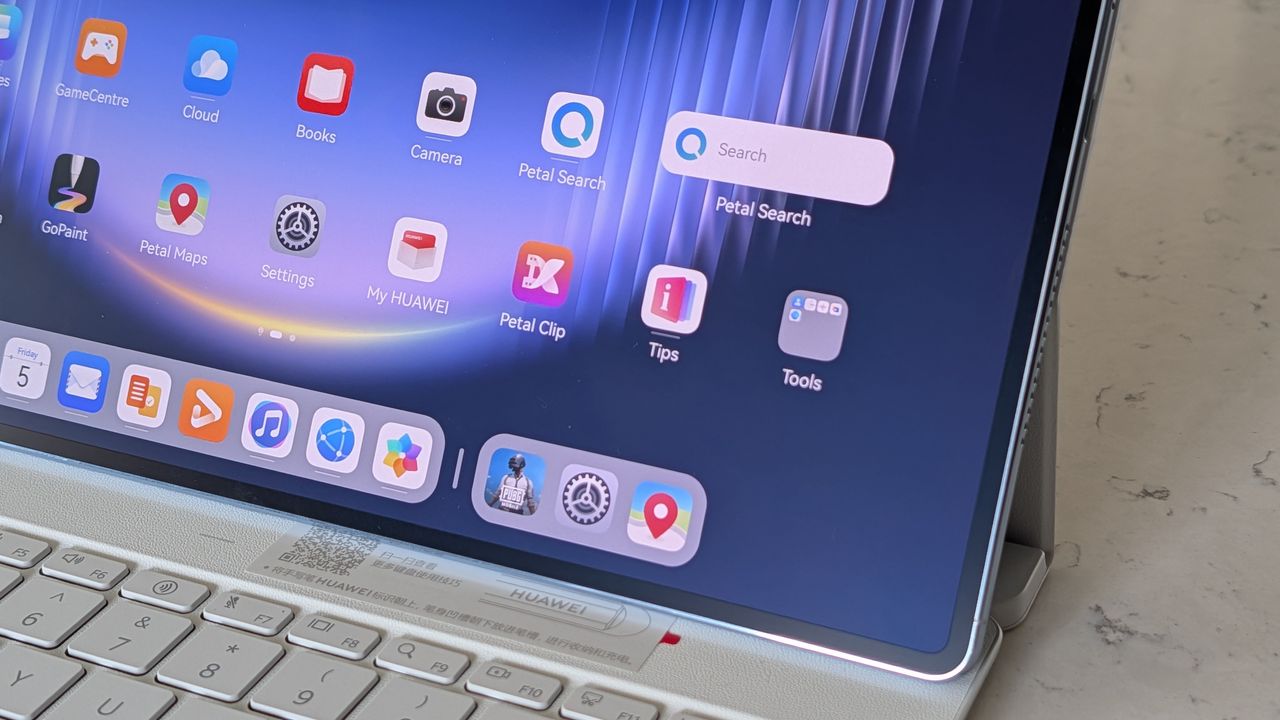 Photos of the Huawei MatePad Pro Max resting on a marble table