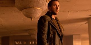 Blade Runner 2049 Ryan Gosling standing in a crumbling ballroom