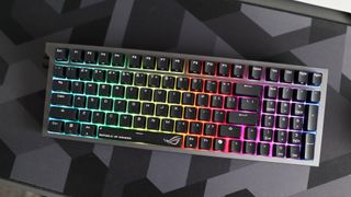 Asus ROG Strix Morph 96 Wireless on a desk mat.