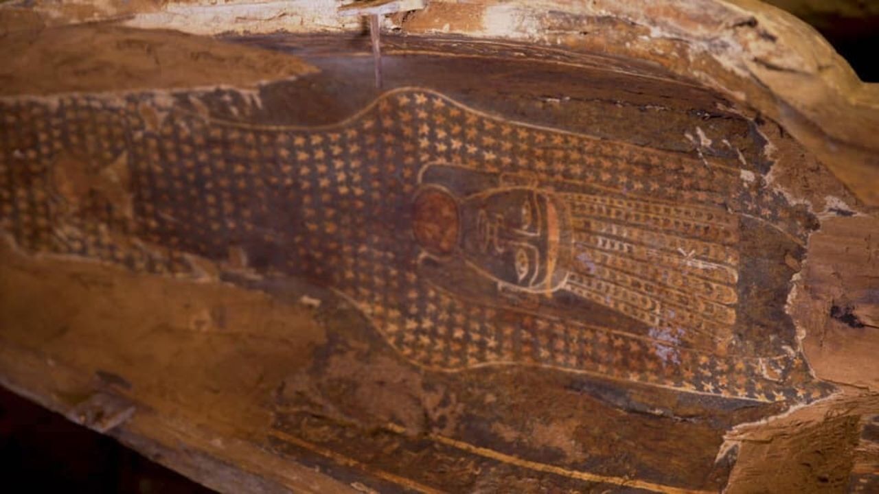 The coffins had intricately painted designs on them.