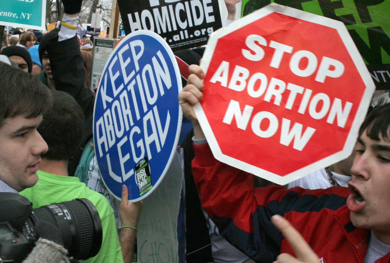 Pro-life and pro-choice demonstrators clash