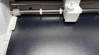 Cricut Joy Xtra review; a close up of a craft machine matt black vinyl and cutter