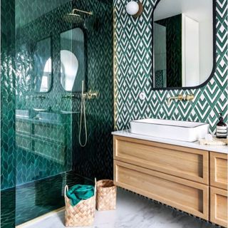 bathroom with green diamond designed wall mirror on wall and shower cabin