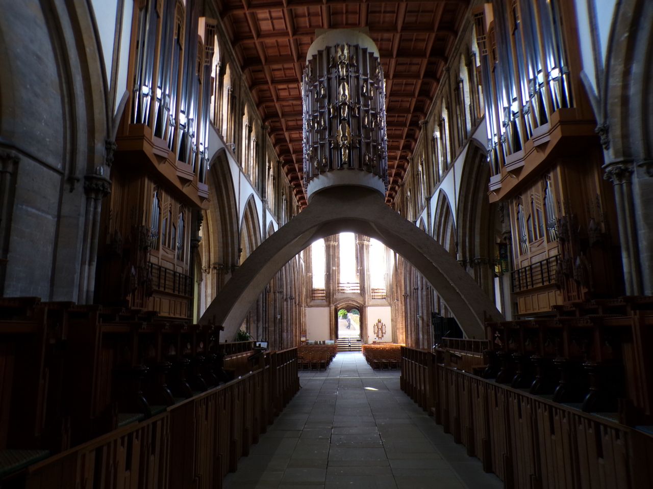 Inside of a large church with stained glass