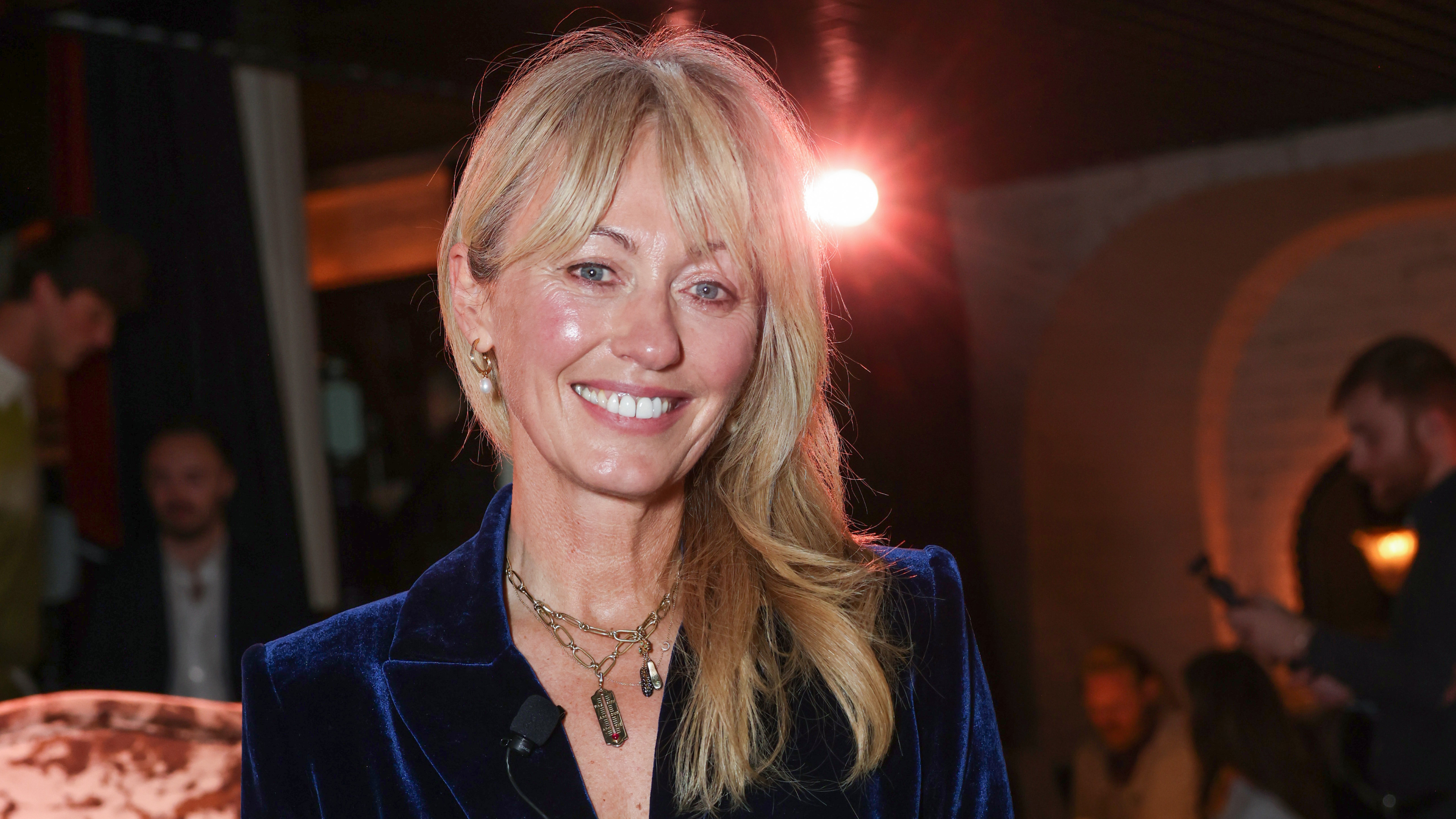 Clodagh McKenna smiling wearing a blue velvet suit at A Taste Of Royal Ascot 2025.