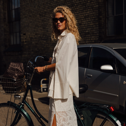 woman wearing an all-white outfit in Copenhagen. 
