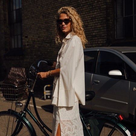 woman wearing an all-white outfit in Copenhagen. 