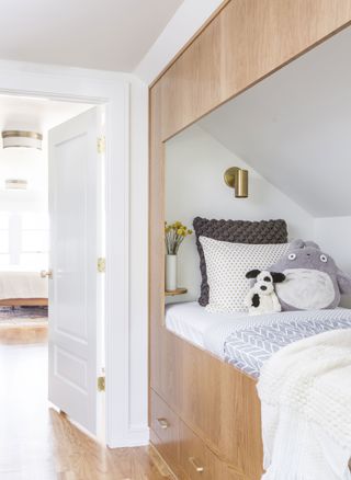 Childs room with built in wooden bed and under bed storage