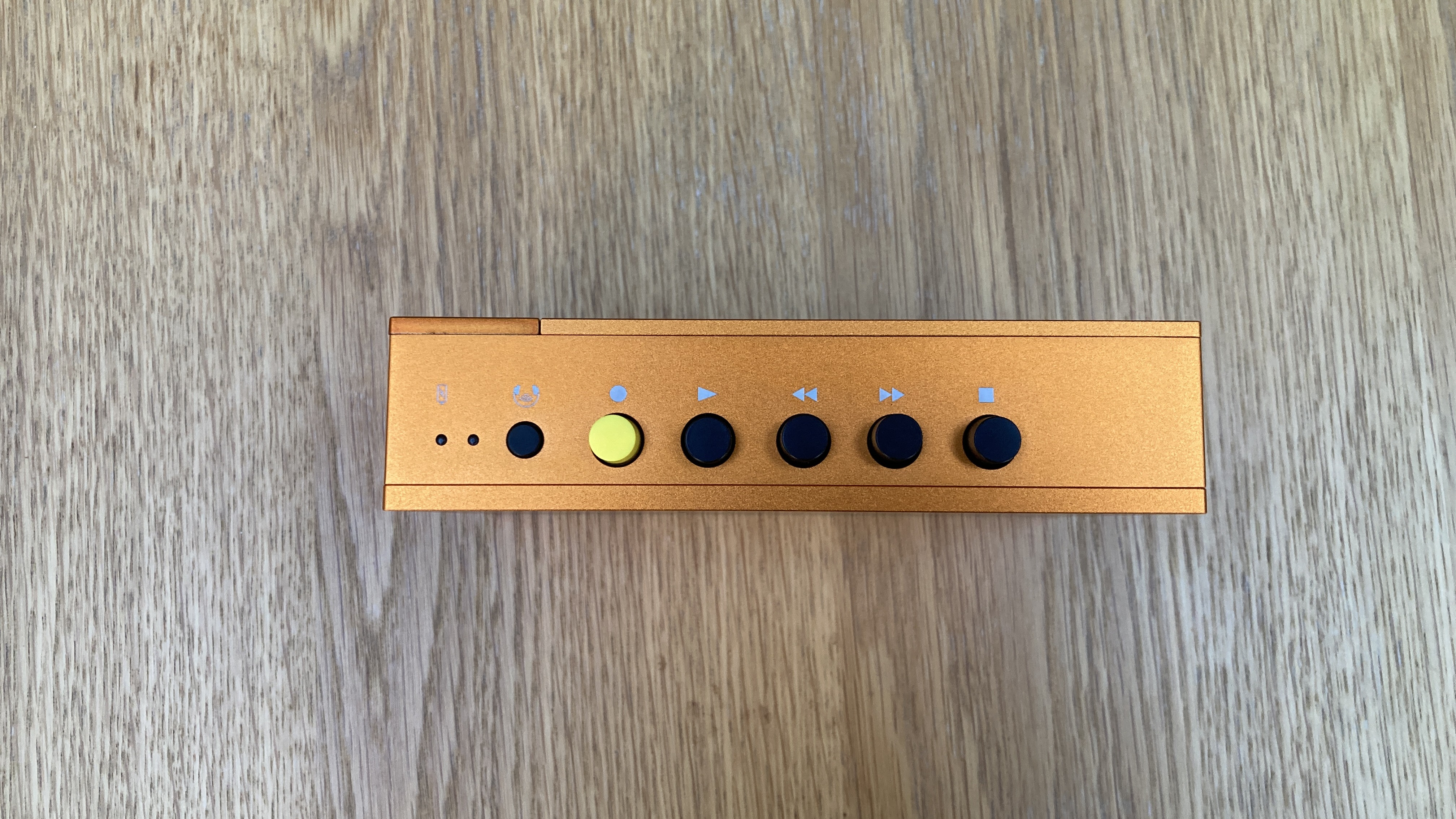 Aerial view of the We Are Rewind WE-001 portable cassette player in serge orange