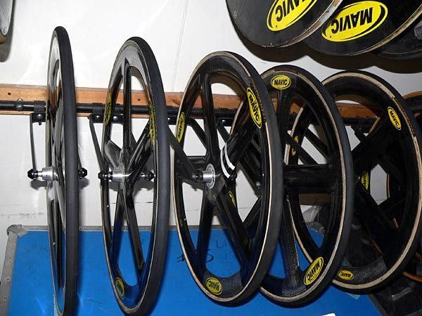 A row of Mavic Io carbon fiber front wheels await their next run around the track.