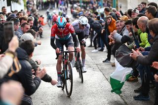 ESTELLA-LIZARRA, SPAIN - MARCH 30: (L-R) Maxim Van Gils of Belgium and Team Lotto Dstny and race winner Brandon Mcnulty of The United States and UAE Team Emirates compete in the breakaway while fans cheer during the 33rd Gran Premio Miguel Indurain 2024 a 198.1km one day race from Estella-Lizarra to Estella-Lizarra on March 30, 2024 in Estella-Lizarra, Spain. (Photo by Tim de Waele/Getty Images)