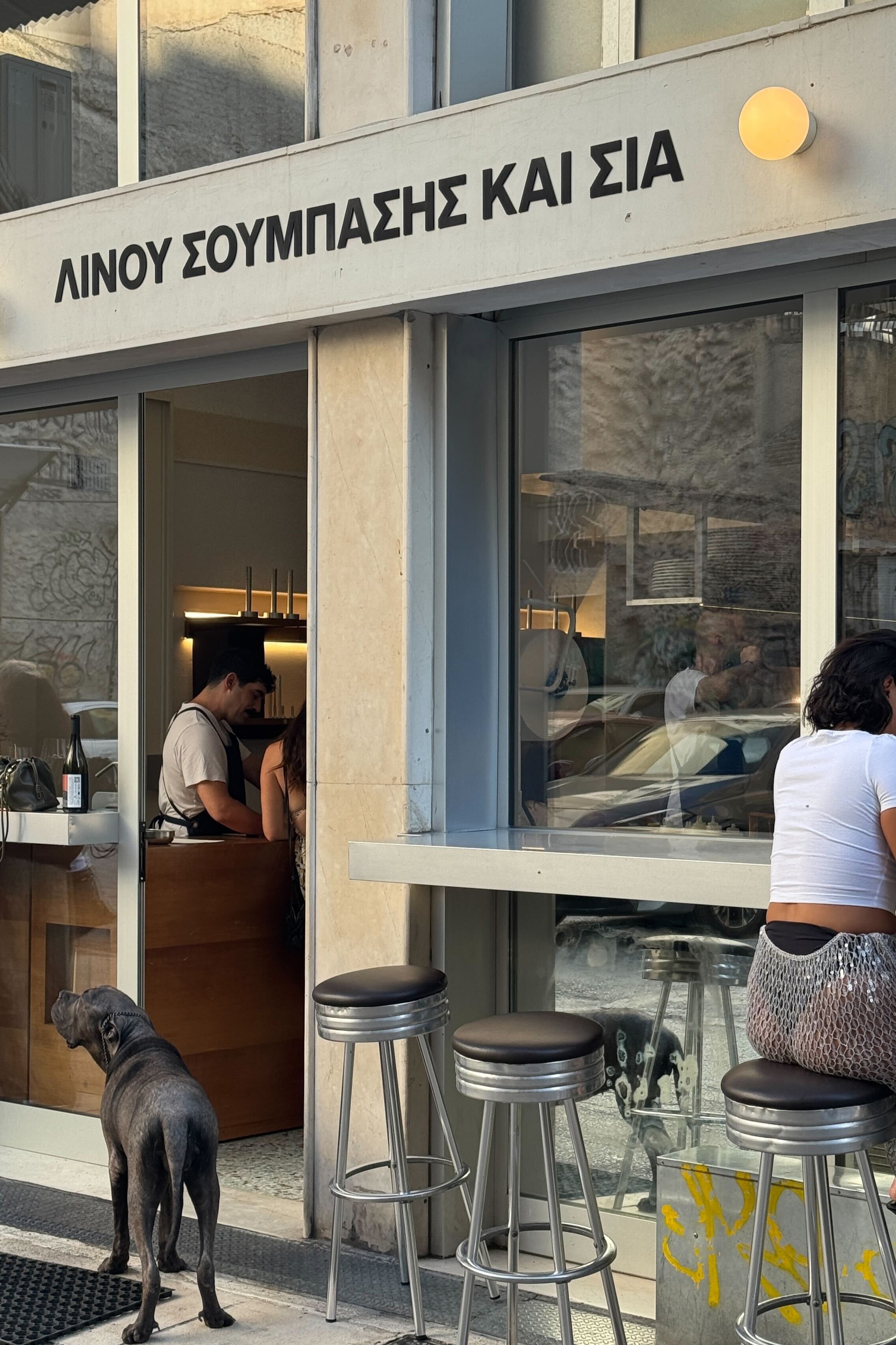A serious of sights, restaurants, plates, and newsstands in Athens merge rough cement buildings with a contemporary vibe.