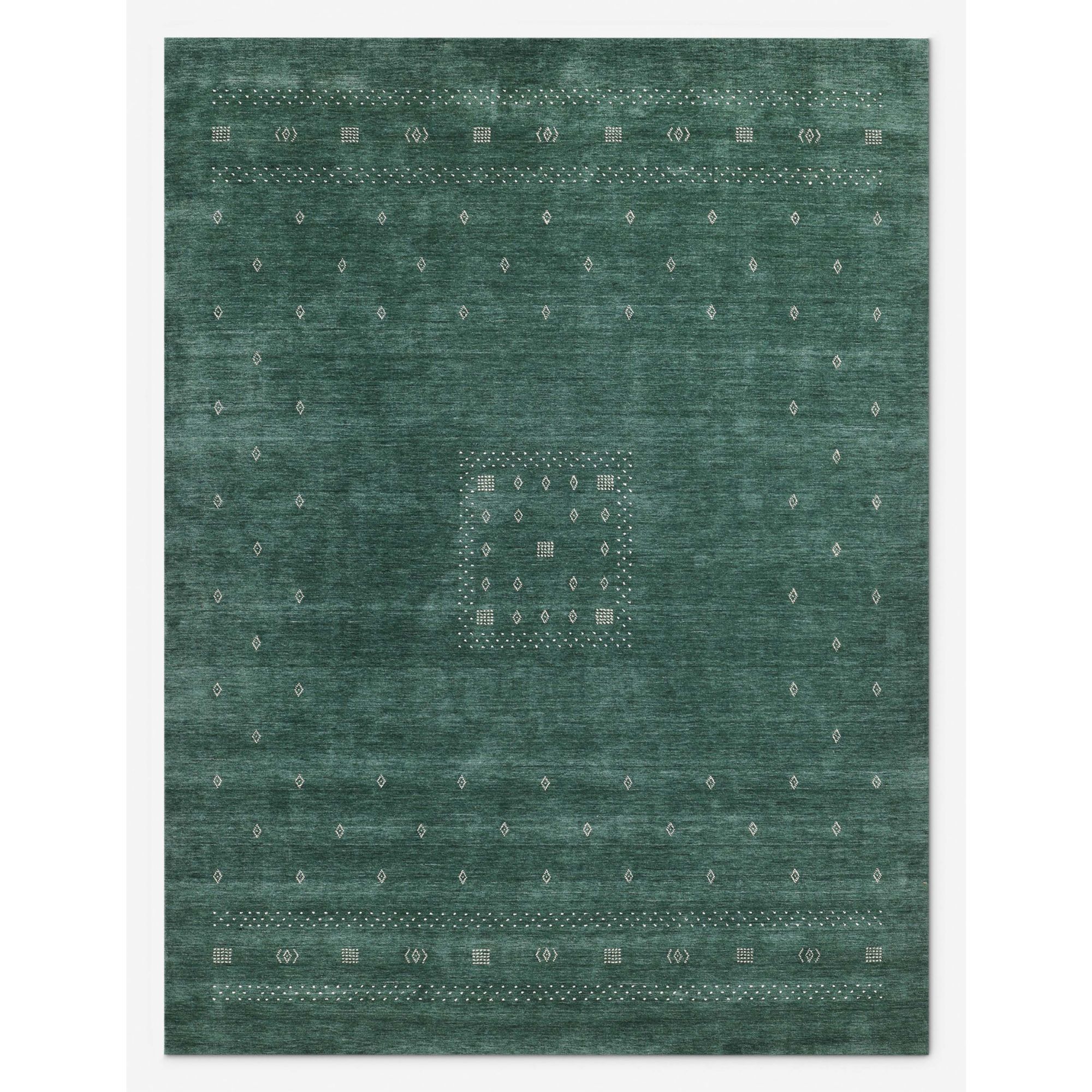 Green rug with rustic pattern and slight worn finish