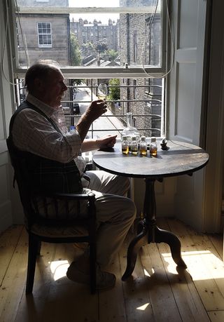 Charlie MacLean, whisky connoisseur, pictured at his home in Edinburgh (©Ian Rutherford/Country Life Picture Library)