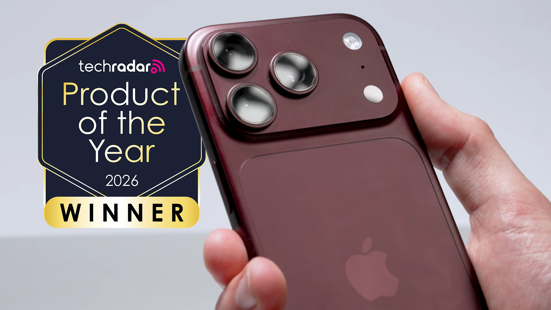 The iPhone 18 Pro held in a hand showing the camera, with a badge saying "TechRadar Product of the Year 2026 winner"