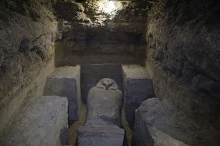 The face of one of the stone sarcophagi discovered in the burial ground.