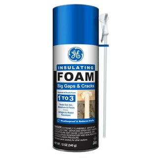 A spray can of insulating foam with a blue lid.