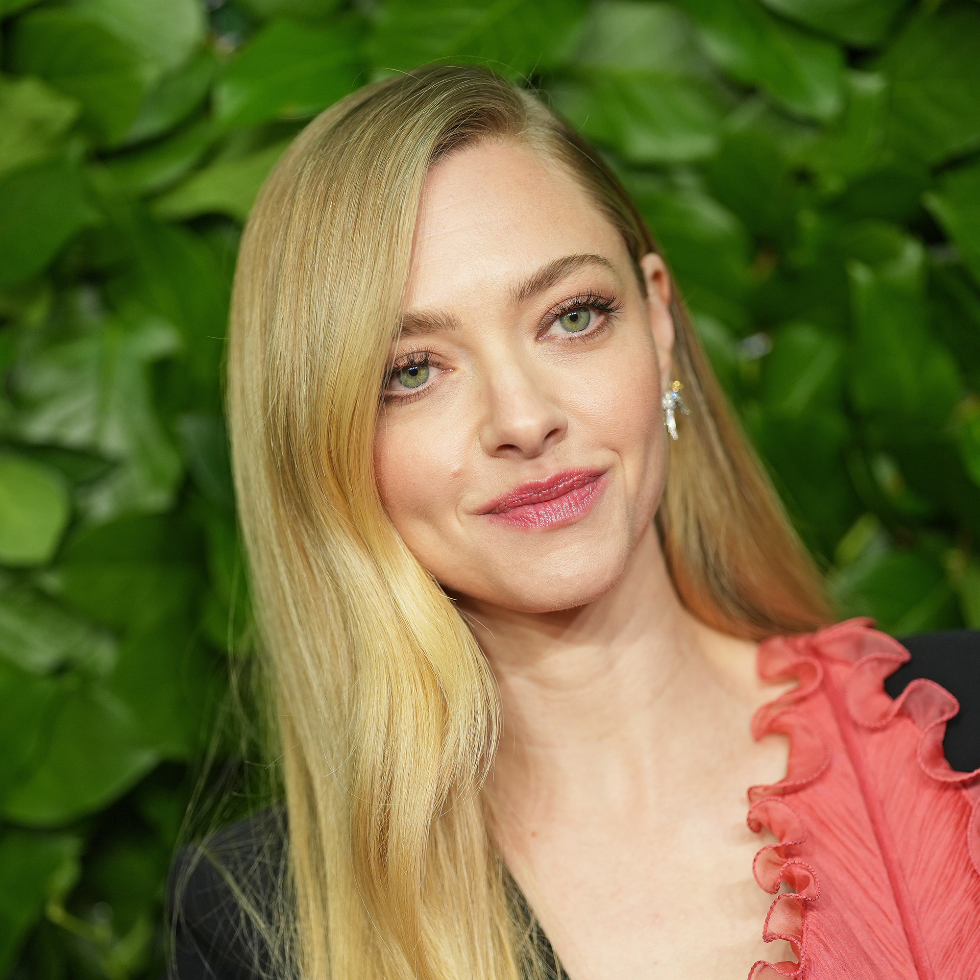 Amanda Seyfried at the 35th Annual Gotham Film Awards in front of leafy green background