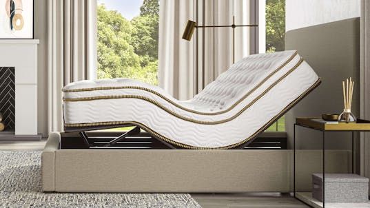 The Saatva Classic mattress on an Adjustable Bed Base in a zero gravity position