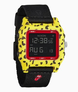 A digital watch with a yellow leopard pattern frame and a black fabric strap.