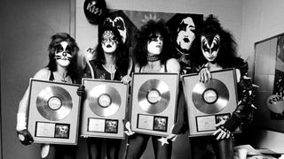 Kiss (L-R): Peter Criss, Ace Frehley, Paul Stanley and Gene Simmons holding Gold discs in recognition of 'Alive!'