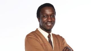 Zephryn Taitte in a brown cardigan as Cyril in Call the Midwife.