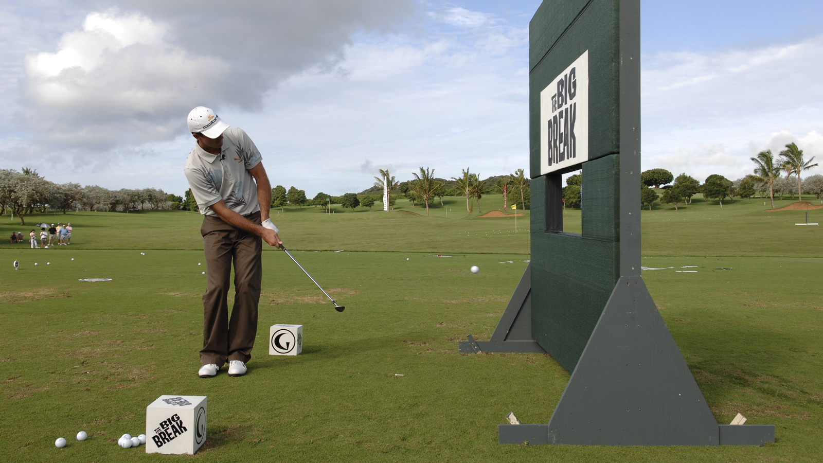 A golfer chips through a Big Break sign