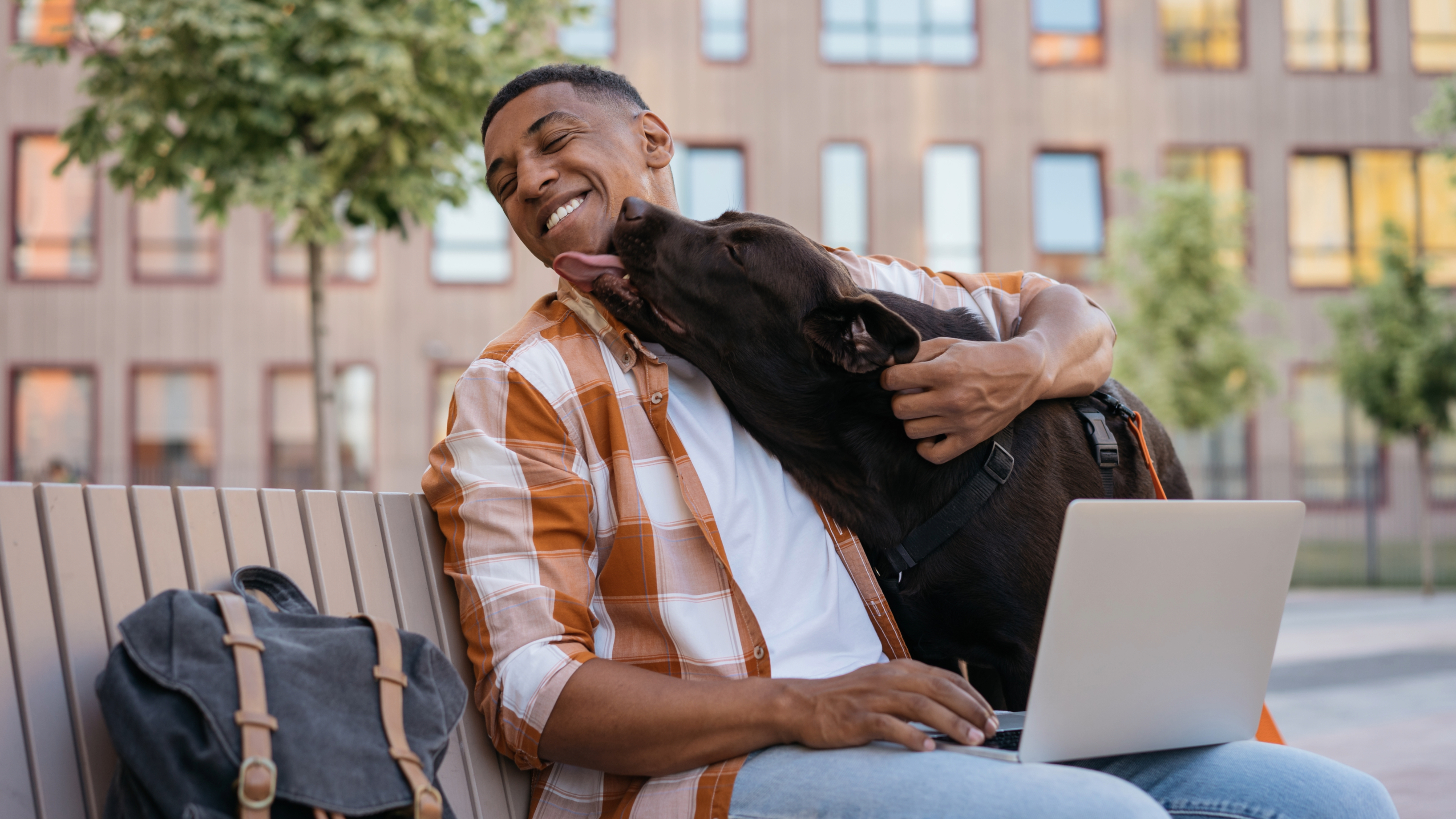Dog licking man's face