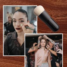 brown background with makeup brushes on top and two models backstage at nyfw getting their makeup done 