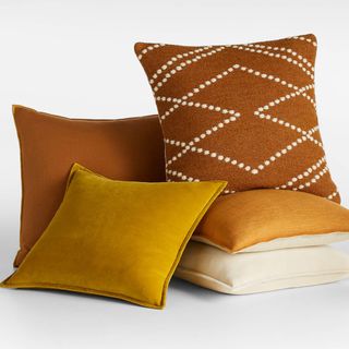 Square throw pillows in a rust orange color