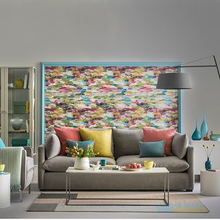 living room with wallpaper on wall and sofaset with cushions