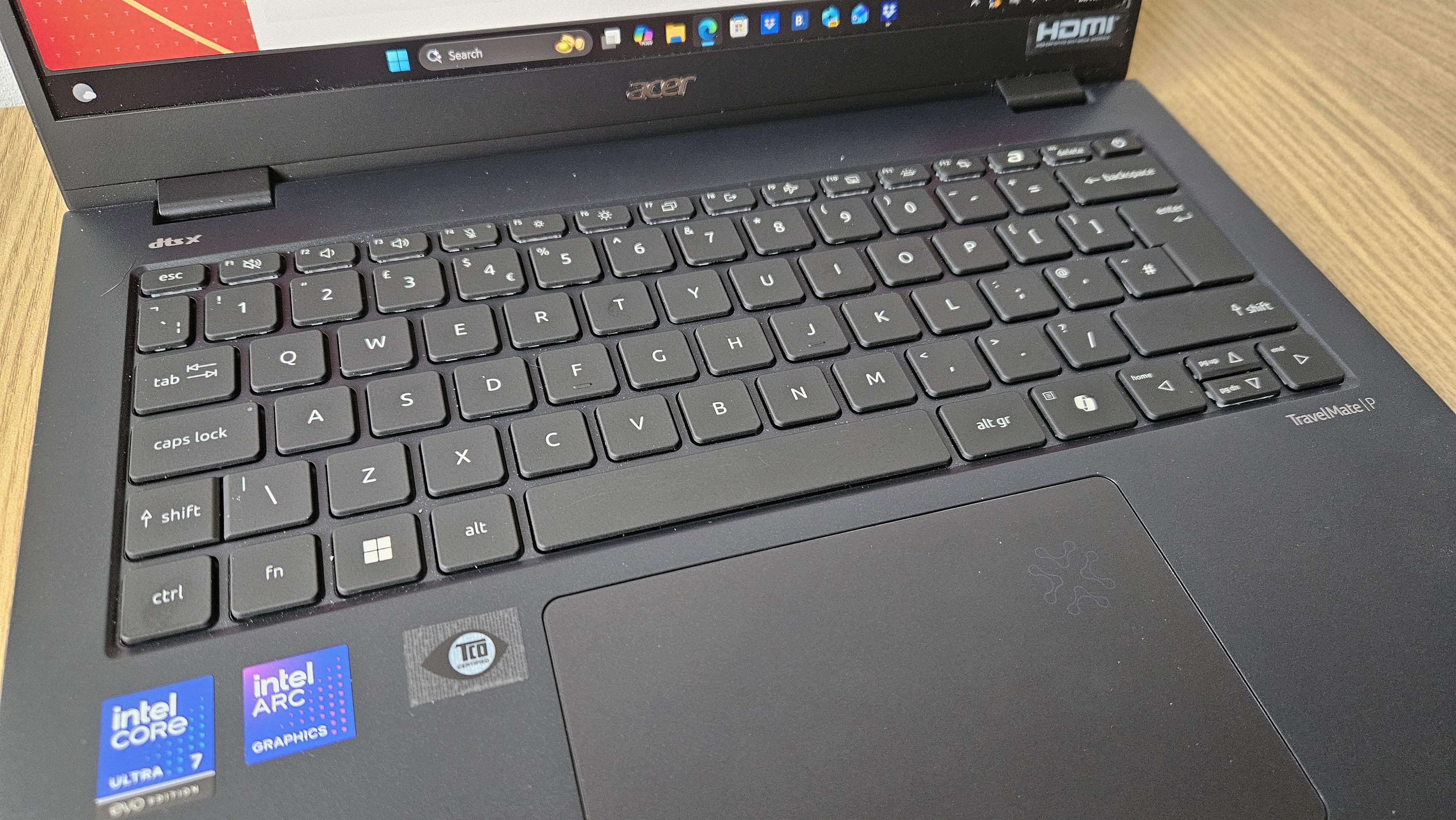 The Acer TravelMate P6 14 AI on a desk