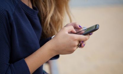 Teen using cell phone