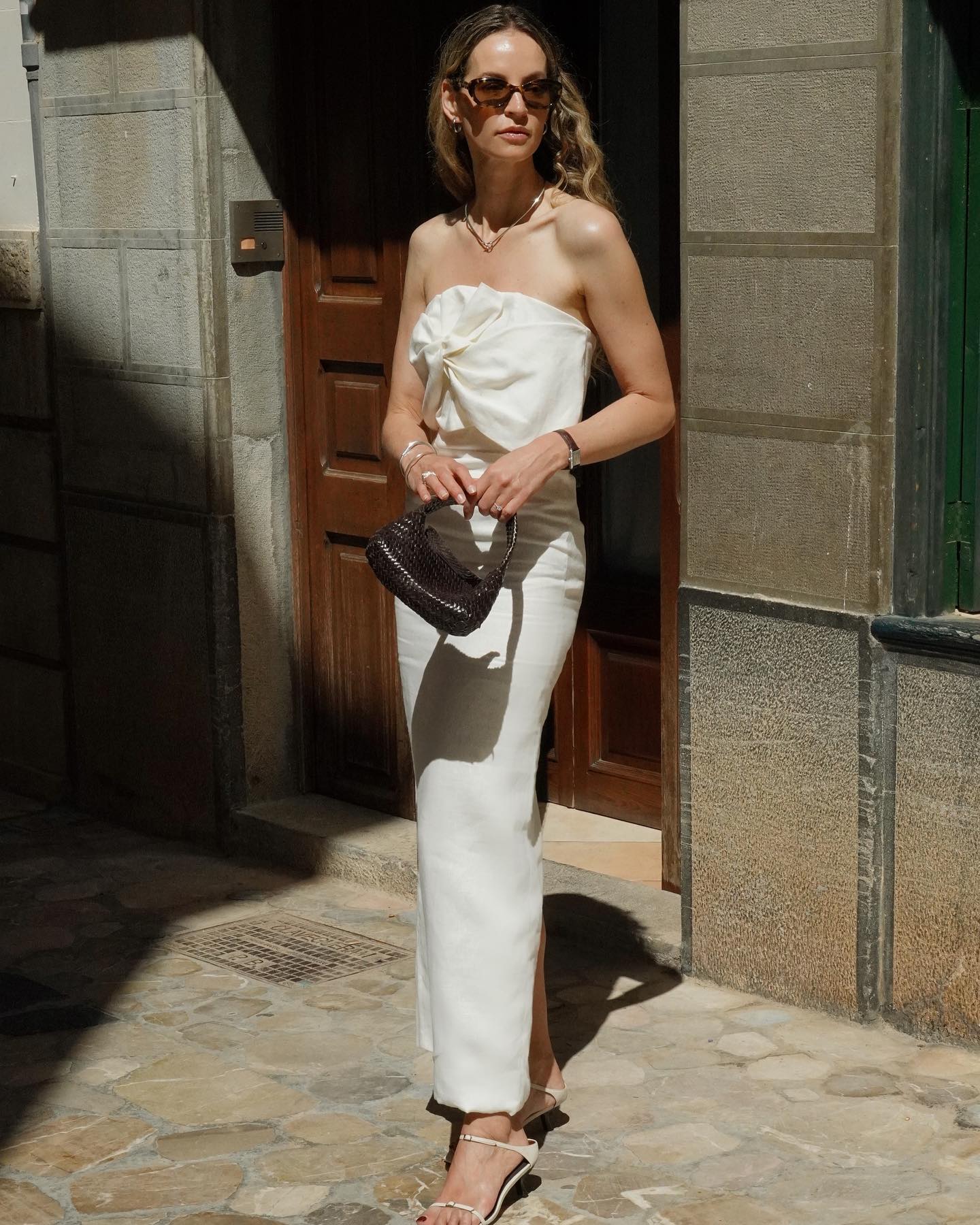 Woman wearing a white linen maxi dress