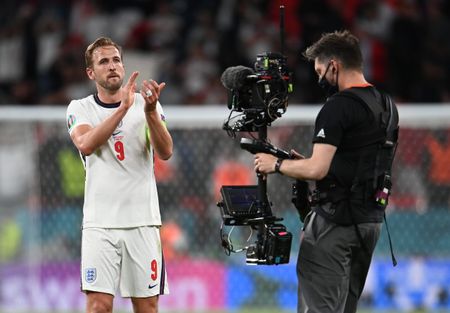 England captain Harry Kane applauds the fans both in Wembley Stadium and at home as he is filmed by a TV cameraman at Euro 2020.