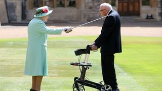 Queen Elizabeth II knighting Captain Tom Moore