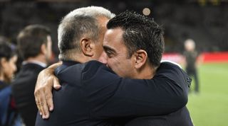 Barcelona president Joan Laporta hugs Xavi ahead of the Gamper Trophy match against Tottenham in August 2023.