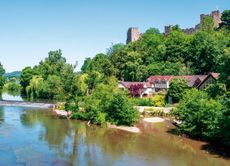 Familes swimming and playing in the River Teme, Shropshire.