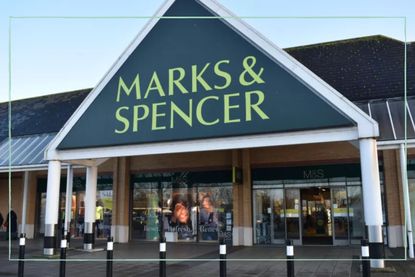 a close up of a M and S store with the store logo and entrance