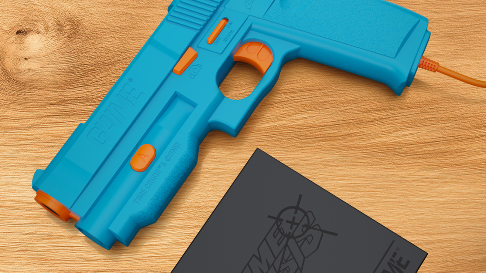 A blue retro lightgun on a wooden table