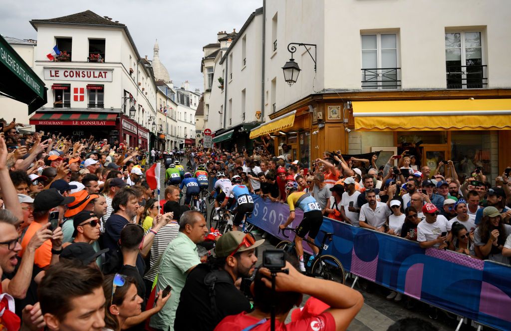 PARIS FRANCE AUGUST 03 A general view of Joshua Tarling of Team Great Britain Ben Oconnor of Team Australia Luka Mezgec of Team Slovenia Luca Mozzato of Team Italy Biniam Girmay of Team Eritrea Magnus Sheffield of Team The United States and Derek Gee of Team Canada compete while fans cheers during the Mens Road Race on day eight of the Olympic Games Paris 2024 at trocadero on August 03 2024 in Paris France Photo by David RamosGetty Images