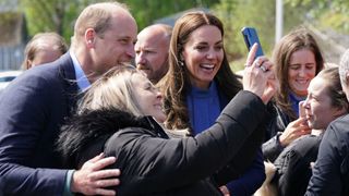Prince William, Duke of Cambridge and Catherine, Duchess of Cambridge meet members of the public during a visit to the Wheatley Group in Glasgow