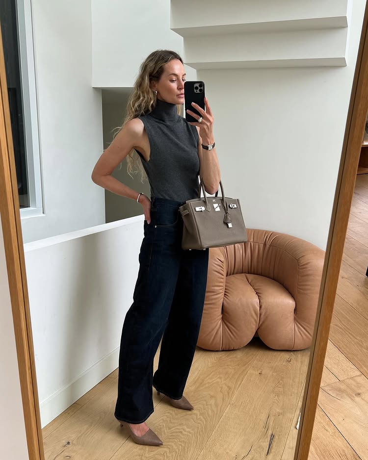 An image of @anoukyve wearing dark-wash denim, one of the biggest denim trends of 2026.