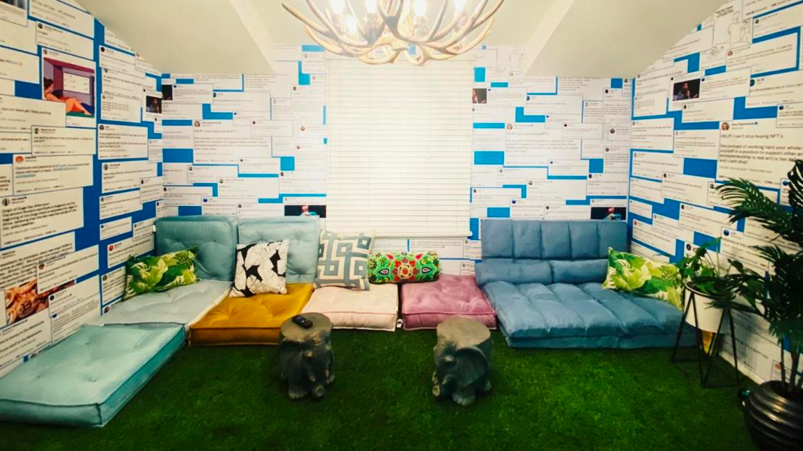 Crypto House; a room with Twitter messages used as wallpaper