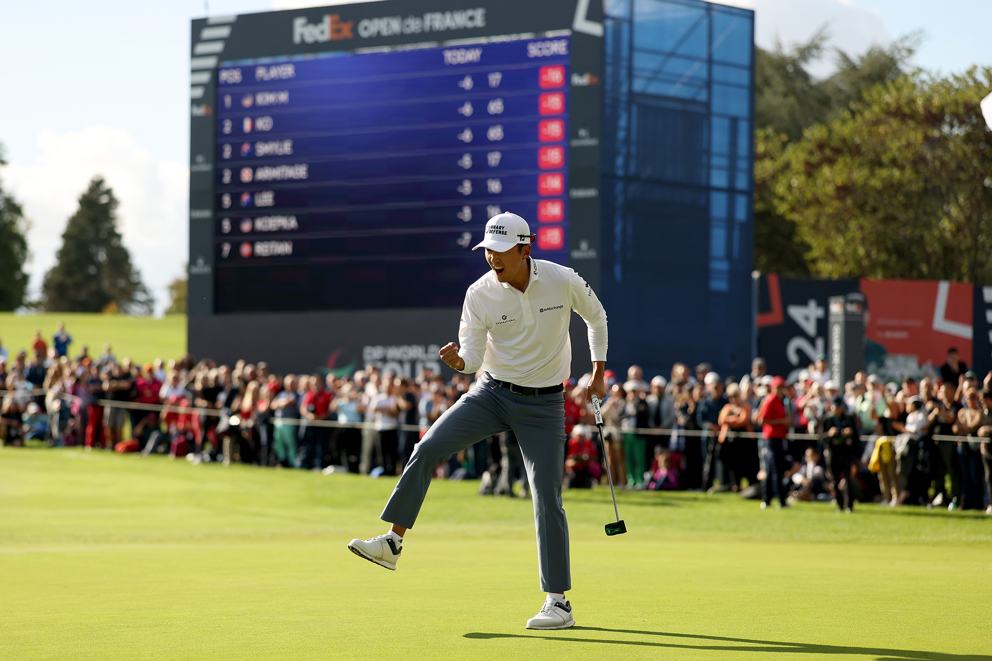 Michael Kim celebrating as he holes a putt to win the Open De France 2025