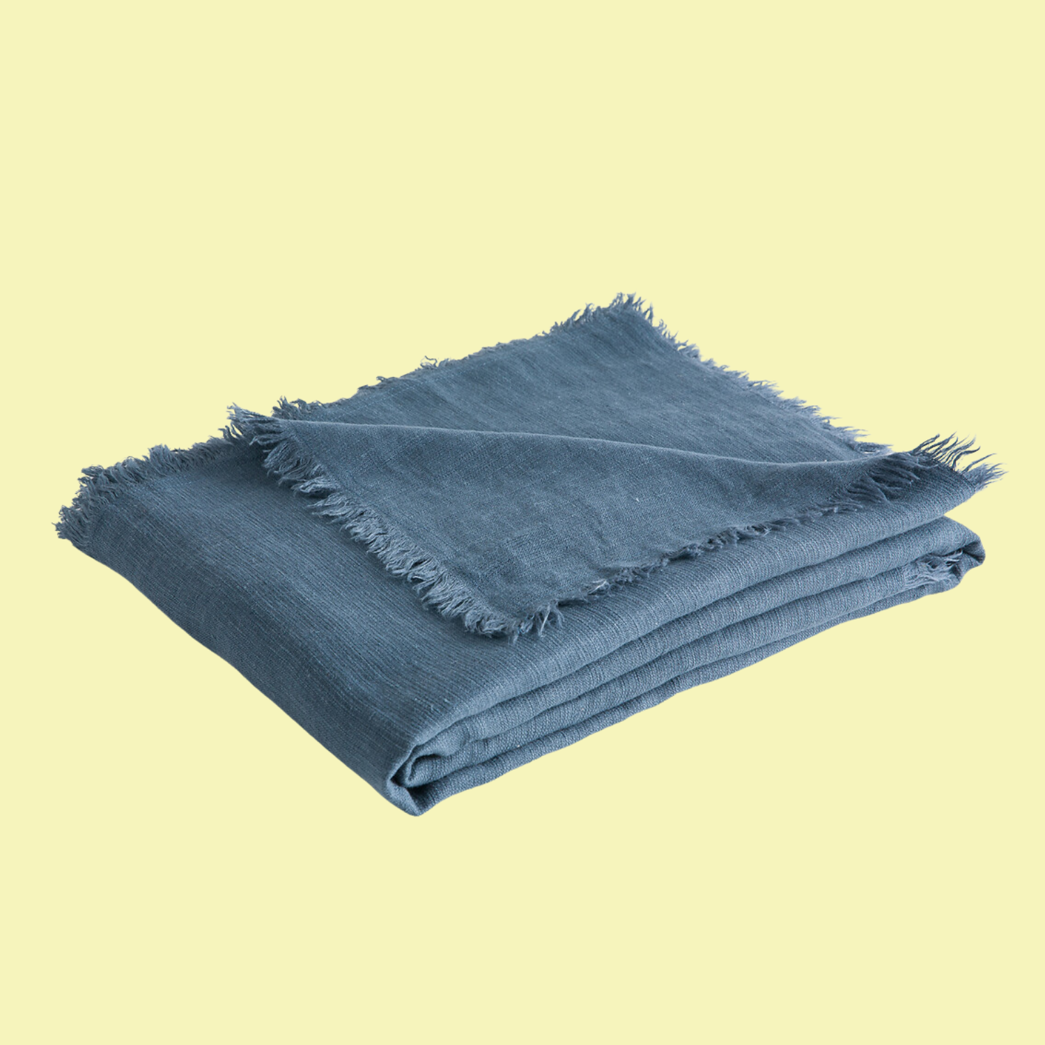 A blue throw with a frayed hem