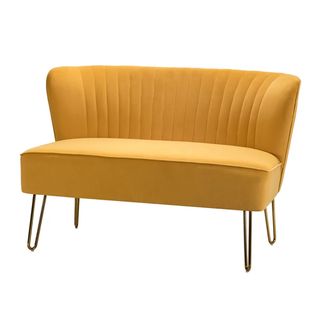 Yellow velvet loveseat with no arms on white background
