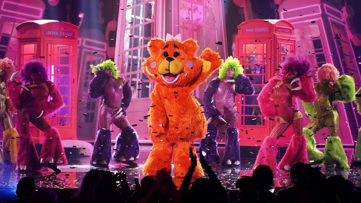 Miss Teddy performs on stage with backup dancers on The Masked Singer